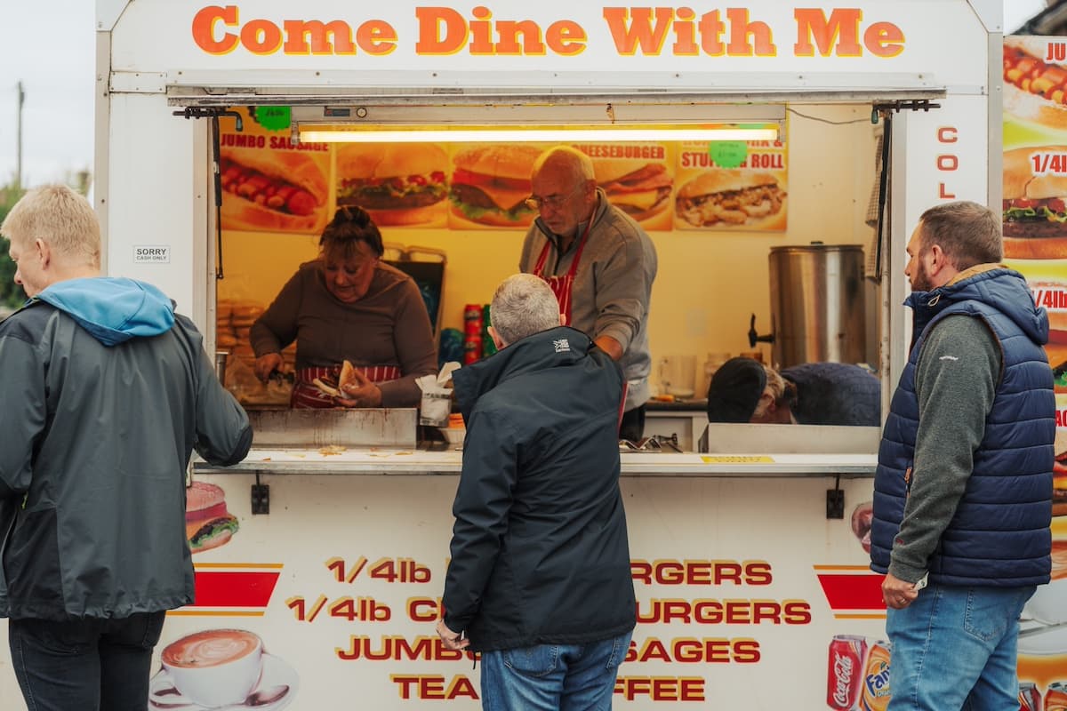 A food vendor serving customers outside the stadium