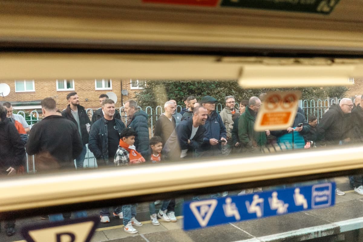 Fans on the platform near the stadium